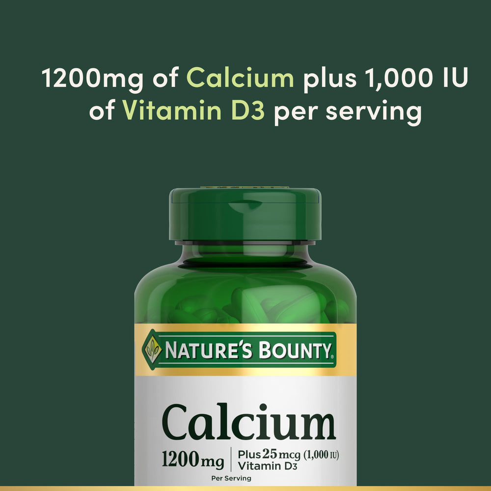 Nature's Bounty softgels in hand showing scale and portion for two-per-day use