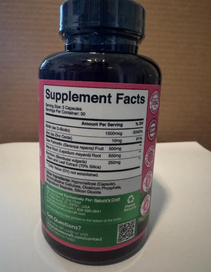 Natures Craft bottle next to a woman preparing to take supplement for hair support