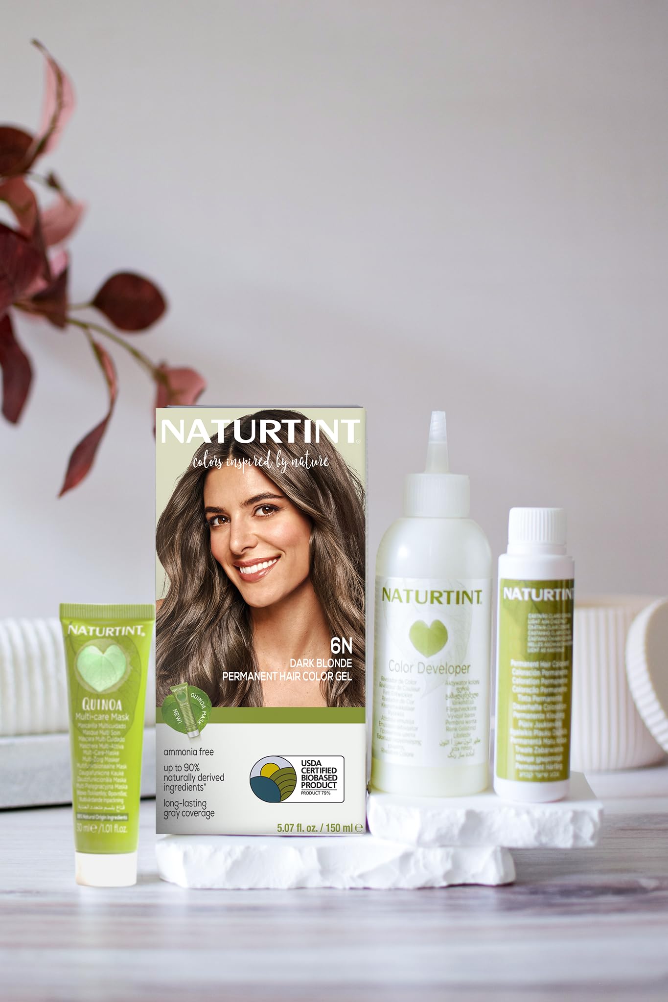 Applying Naturtint 6N to roots demonstrating easy at-home use benefit