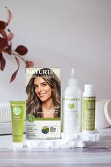 Applying Naturtint 6N to roots demonstrating easy at-home use benefit