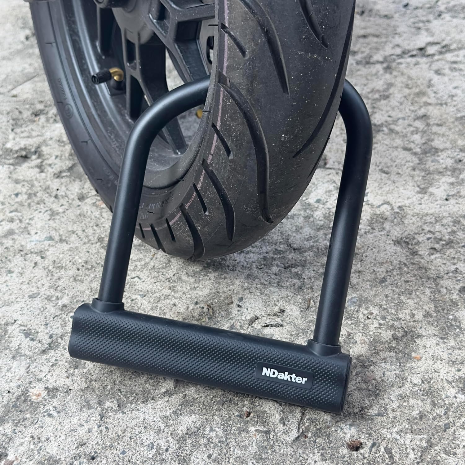 NDakter U lock next to wheel and pole illustrating real-world fit