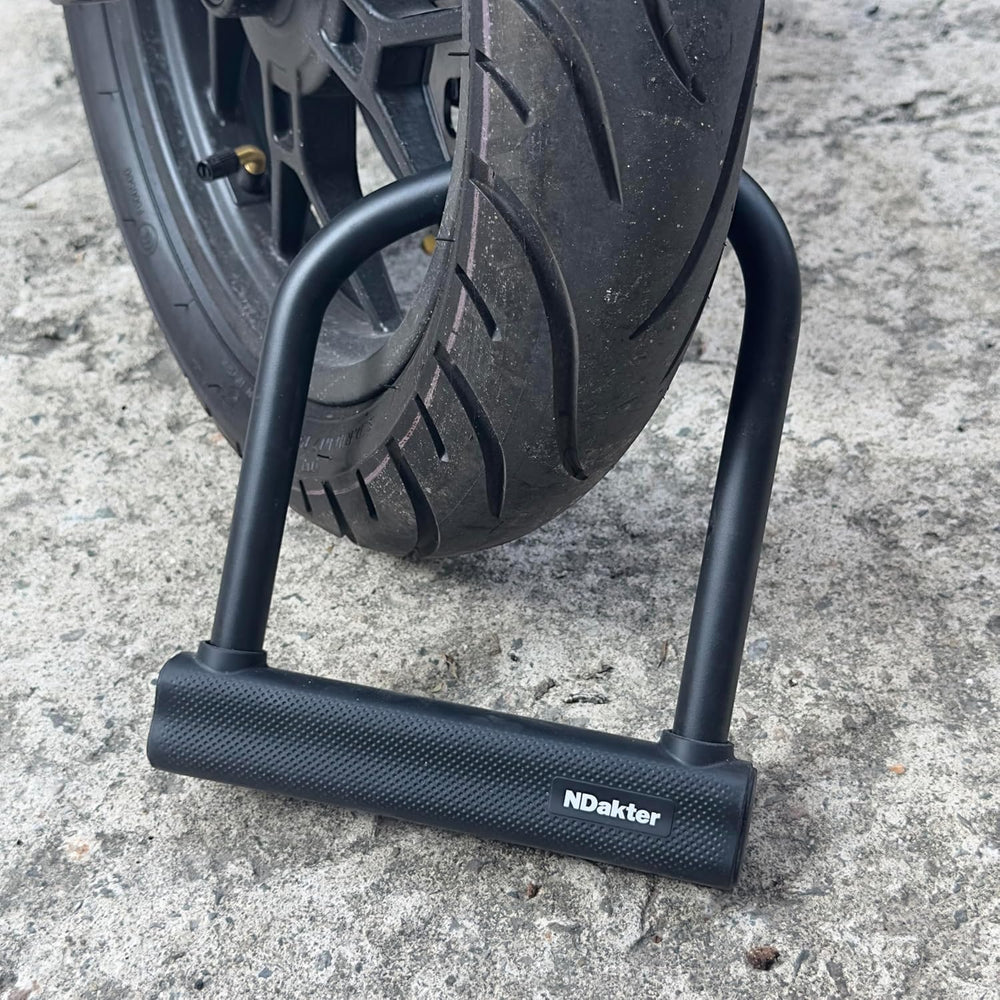 NDakter U lock next to wheel and pole illustrating real-world fit
