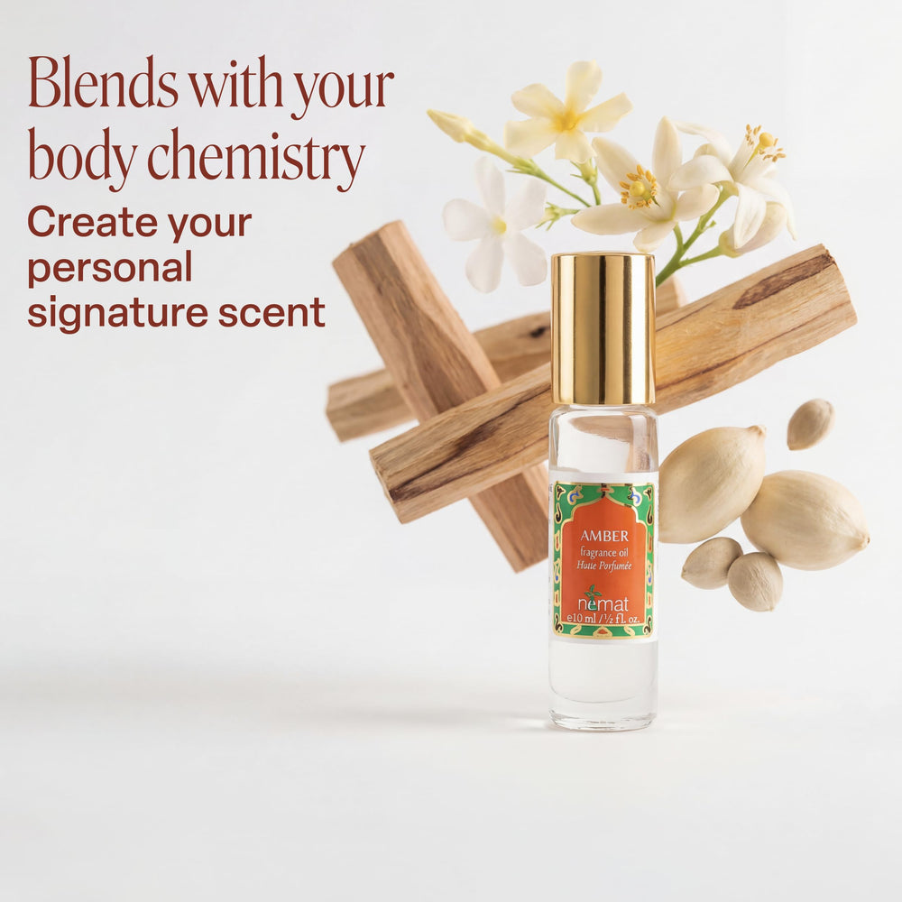Nemat amber oil drop on skin demonstrating concentrated oil texture and gentle absorption