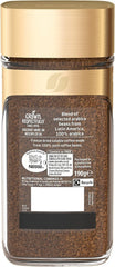 Nescafe jar open with visible instant coffee granules ready to scoop
