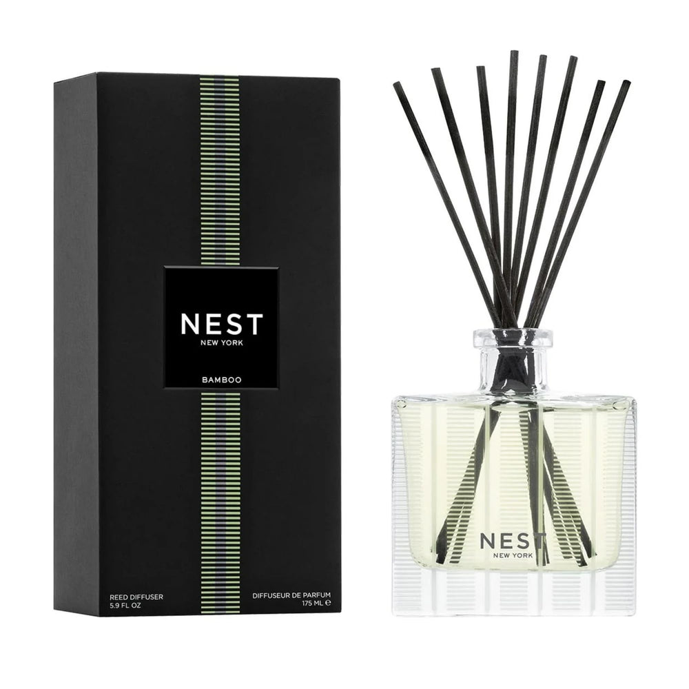 NEST New York front view of bamboo reed diffuser showing elegant glass vessel and reeds for long-lasting scent