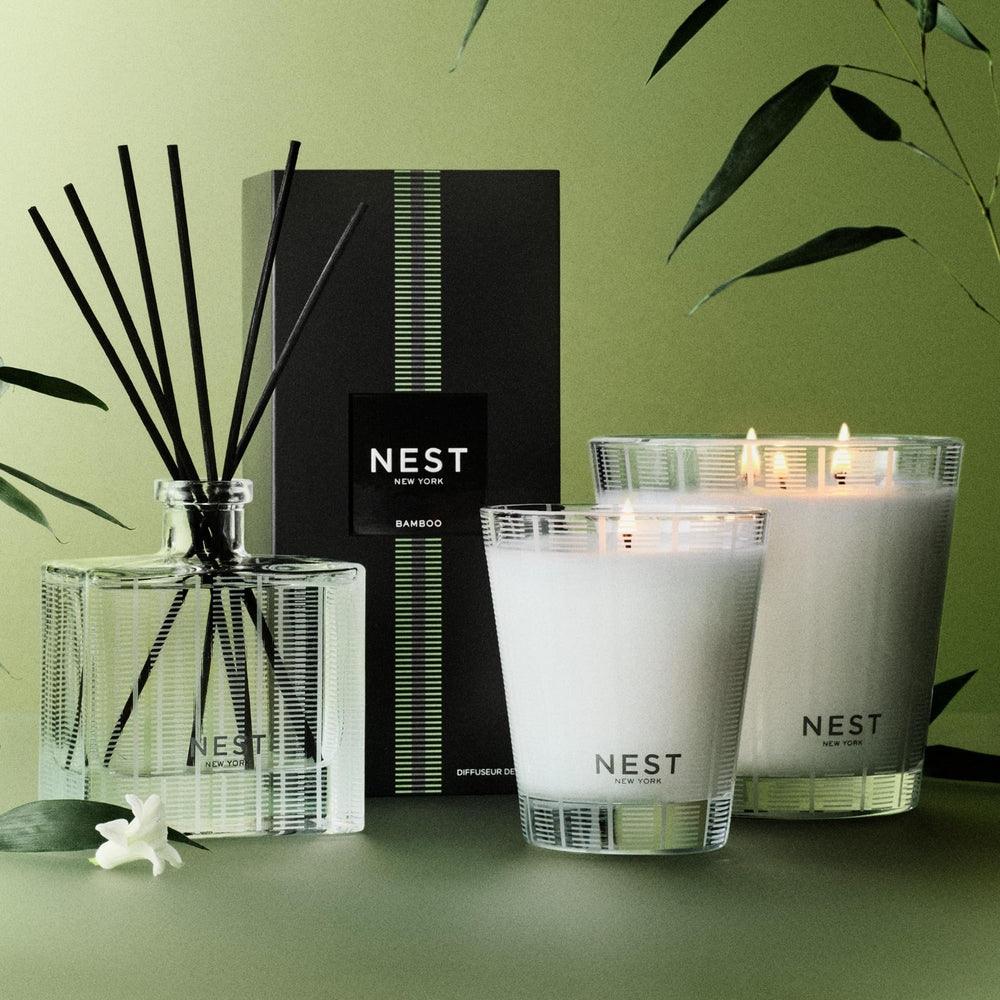 NEST New York diffuser held in hand showing 5.9 fl oz scale and portability for room placement