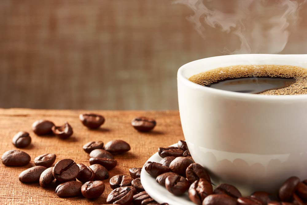 New England Coffee small-batch roast scene with beans highlighting consistent balanced flavor