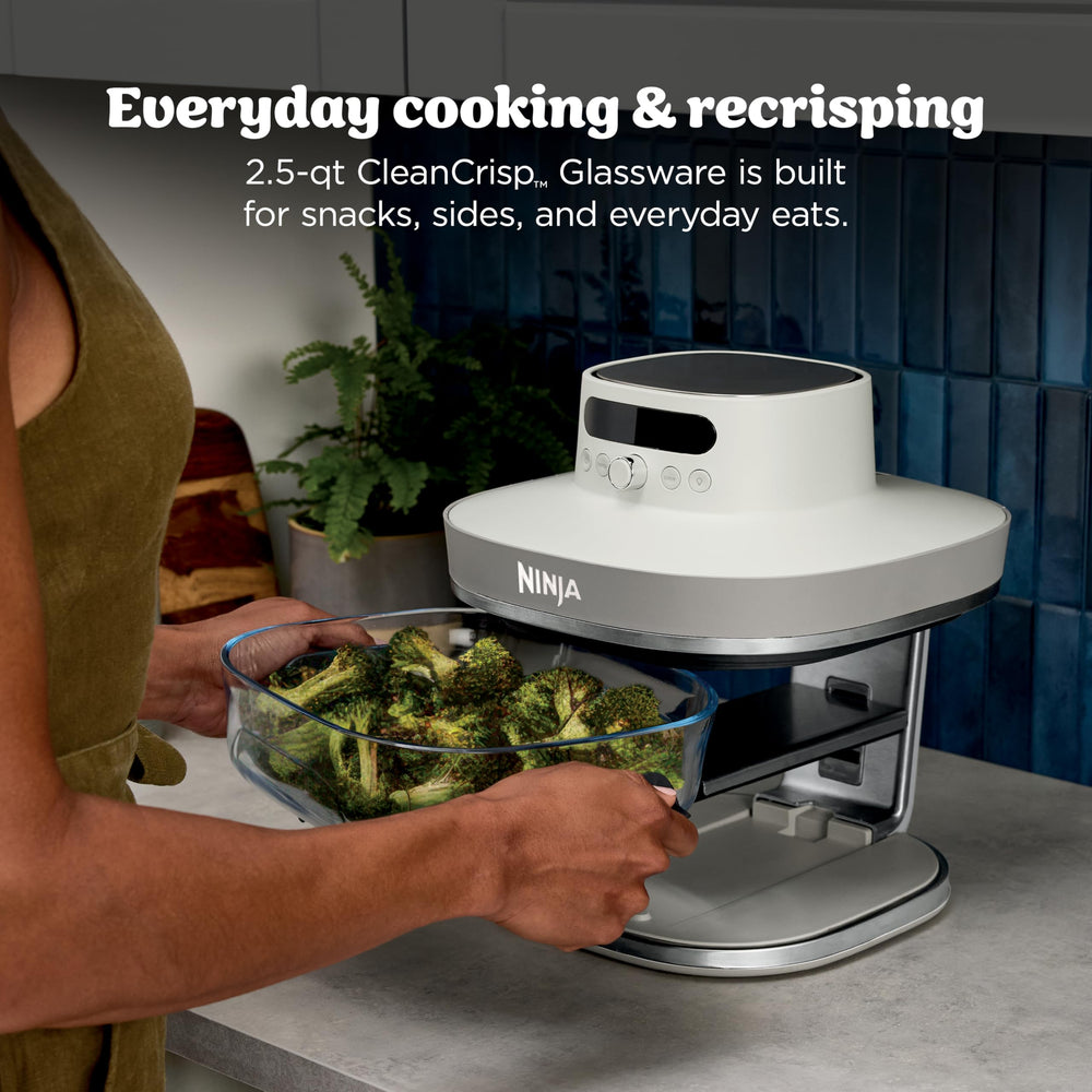 Ninja air fryer cooking chicken wings with visible browning for fast crisping benefit