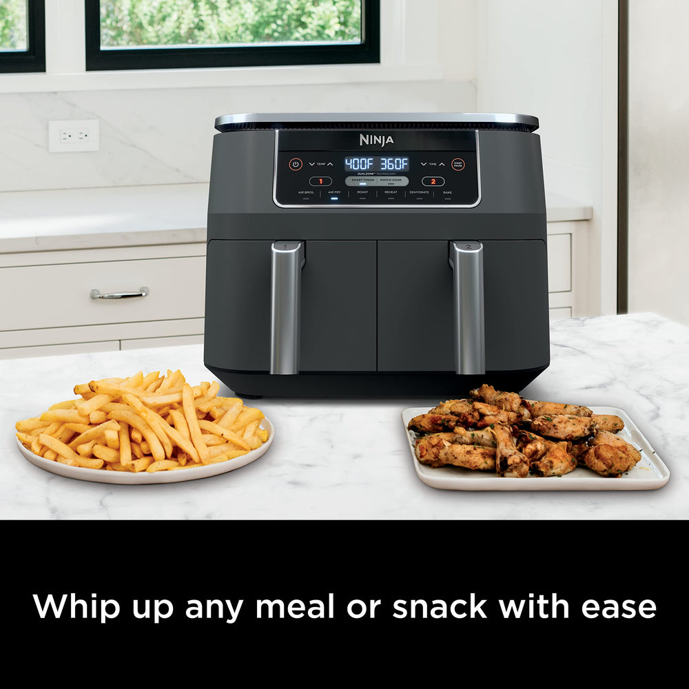 Ninja DZ201 cooking wings in one basket and fries in the other for simultaneous meals