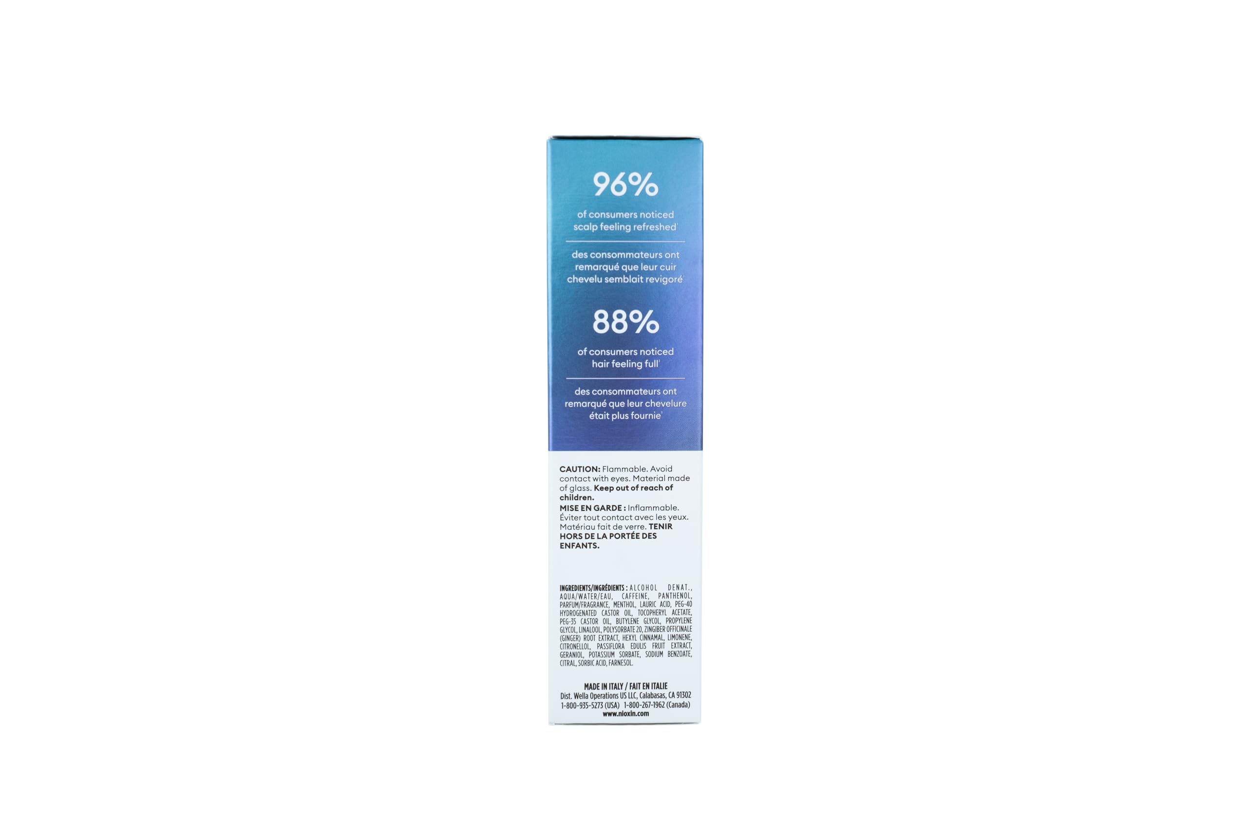 Hand holding Nioxin bottle showing product size and travel-friendly convenience