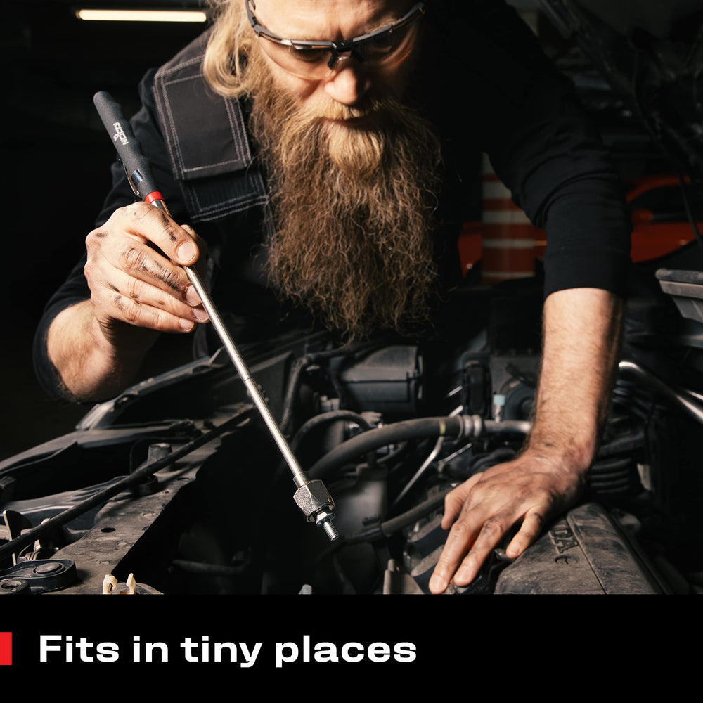 NoCry tool in use picking up a screw from engine bay showing convenient retrieval