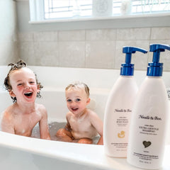 Noodle & Boo baby bath in use with infant enjoying soothing cleanse