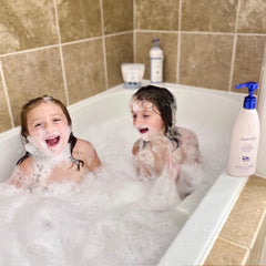 Noodle & Boo in-bathroom use on child demonstrating gentle conditioning and easier combing