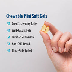 Nordic Naturals serving size shown in a child’s hand to demonstrate scale and convenience