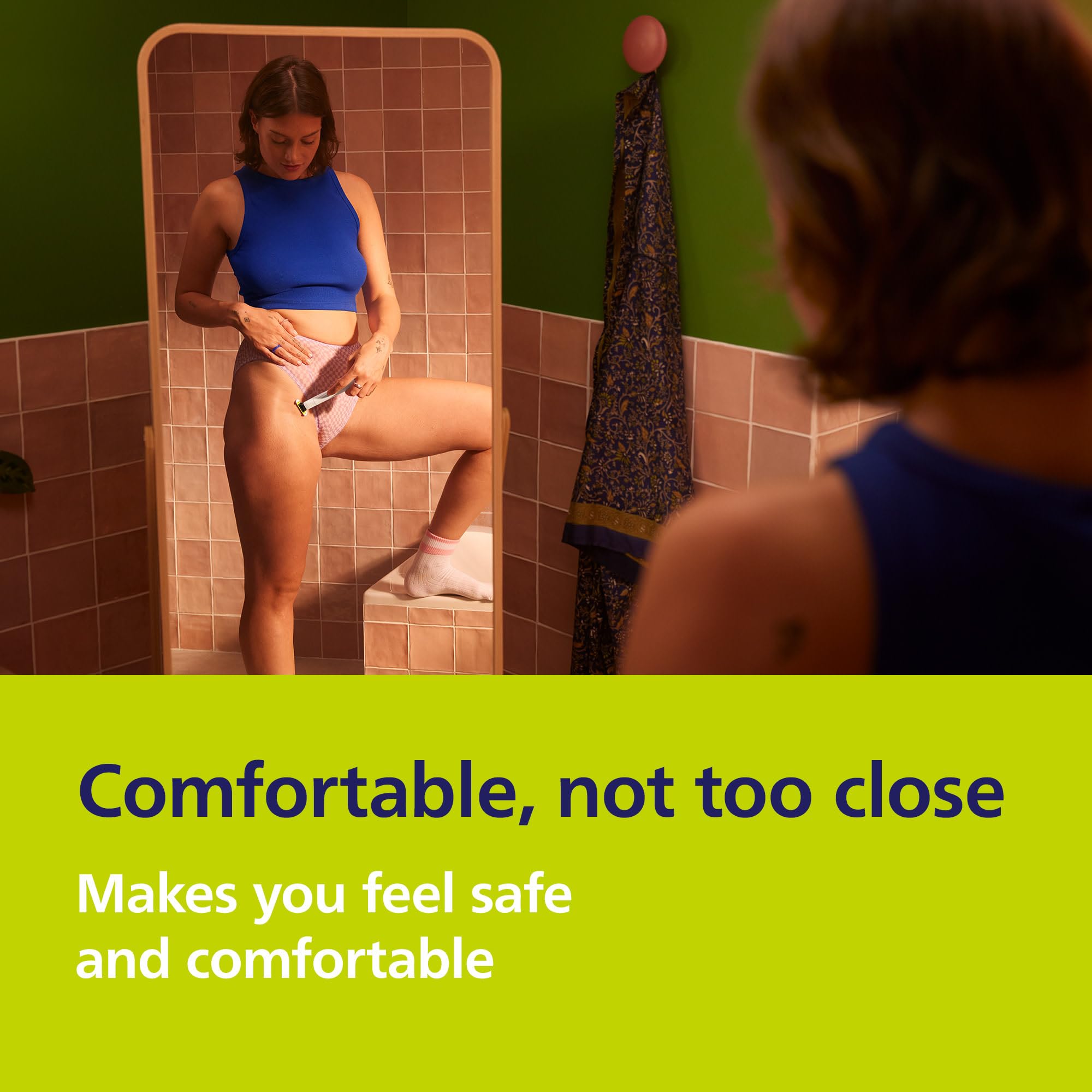 Philips Norelco OneBlade Intimate kit laid out showing included blade and accessories benefit