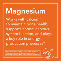 NOW magnesium citrate tablets in hand to show scale and tablet shape, convenient daily dosing benefit