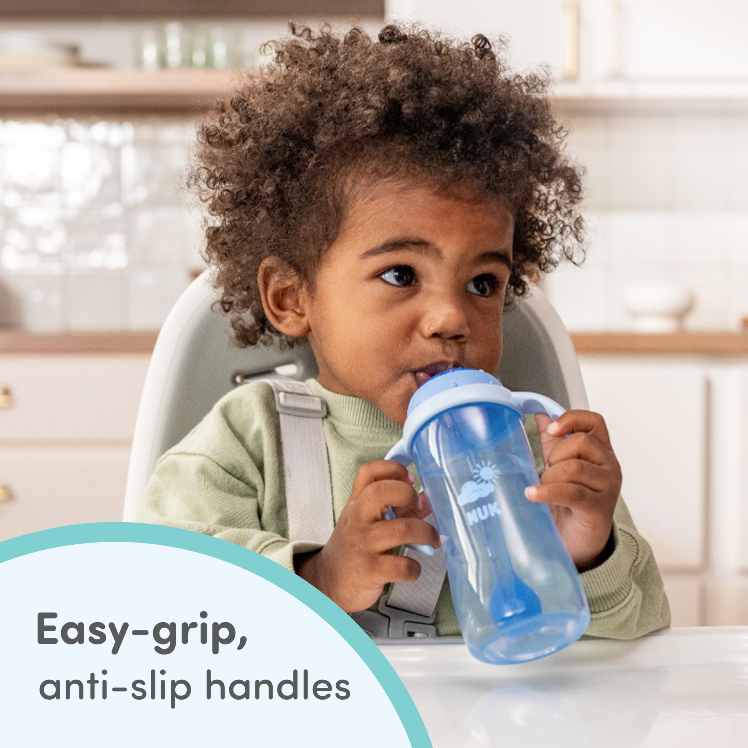 NUK weighted straw following liquid demonstrating angled drinking benefit