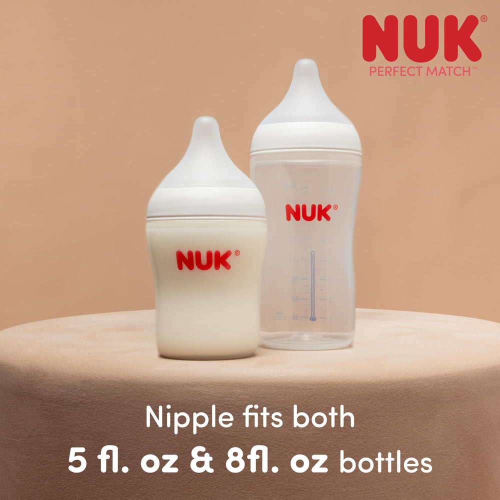 NUK lifestyle scene of caregiver feeding baby demonstrating comfort