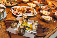 Nuri open tin of sardines in pure olive oil showing moist fillets and ready-to-eat convenience
