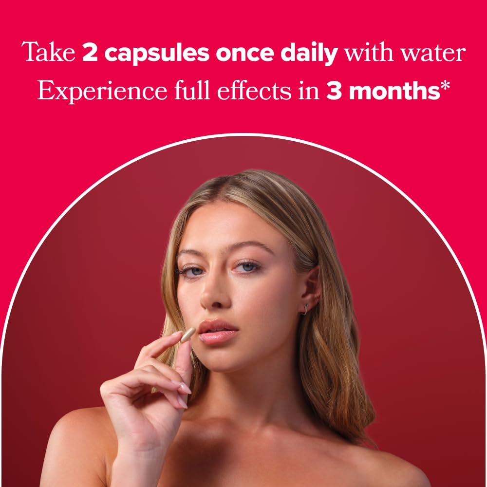 Hand holding O Positiv capsules to show size and daily-dosage convenience