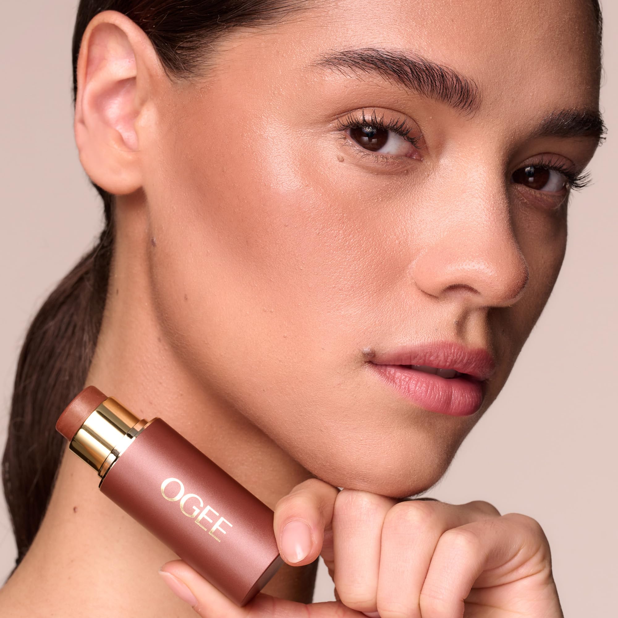 Ogee stick held in hand showing size and ease of on-the-go contouring