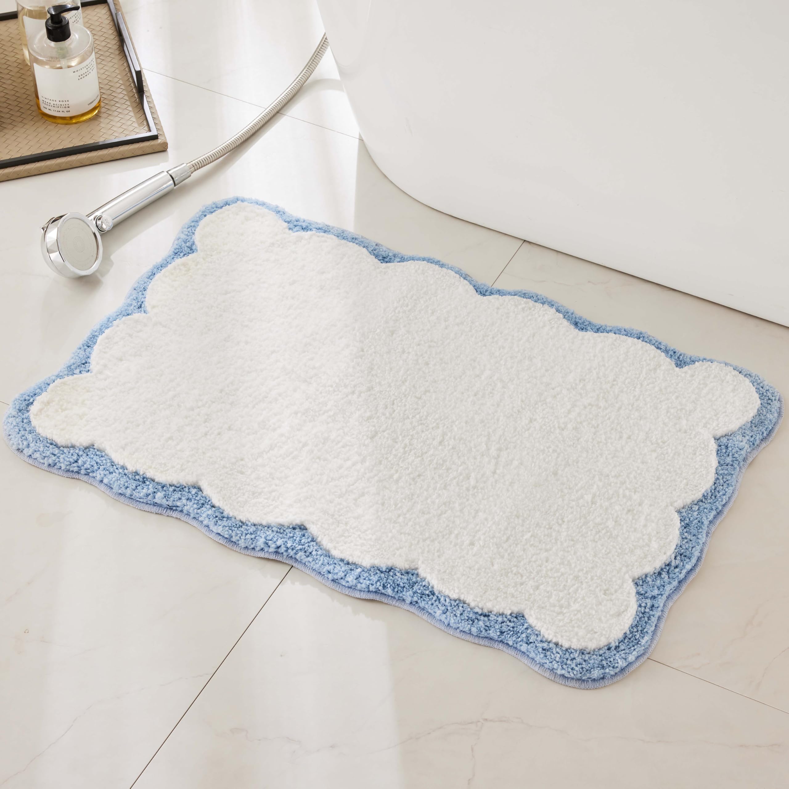 Ohocut front view white rug with blue scalloped piping shows clean aesthetic and softness