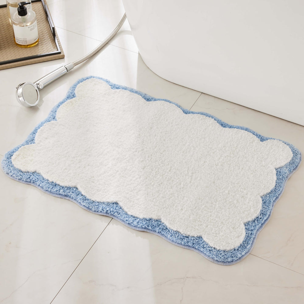 Ohocut front view white rug with blue scalloped piping shows clean aesthetic and softness