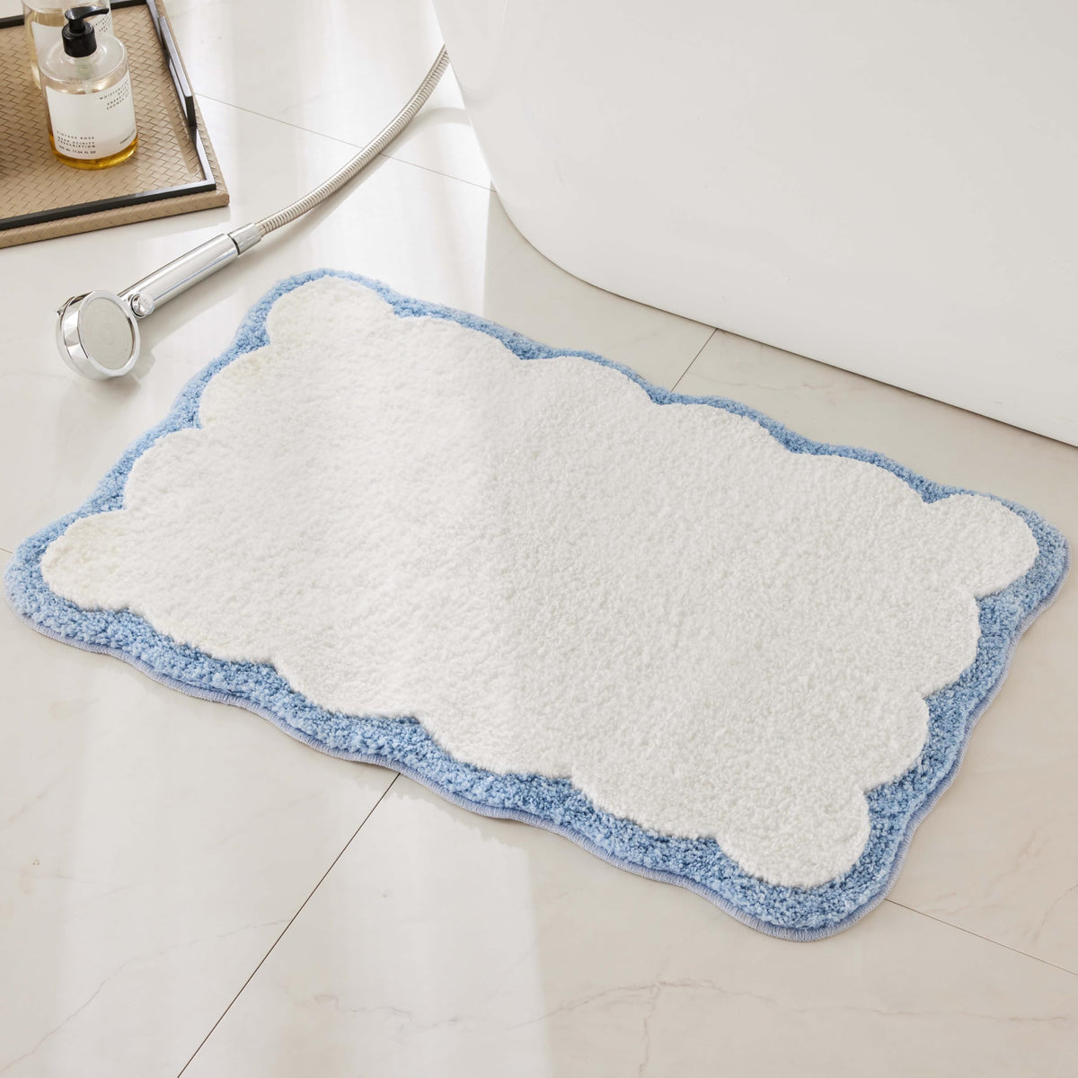 Ohocut front view white rug with blue scalloped piping shows clean aesthetic and softness