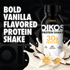 Oikos vanilla pouring into a glass to show creamy texture