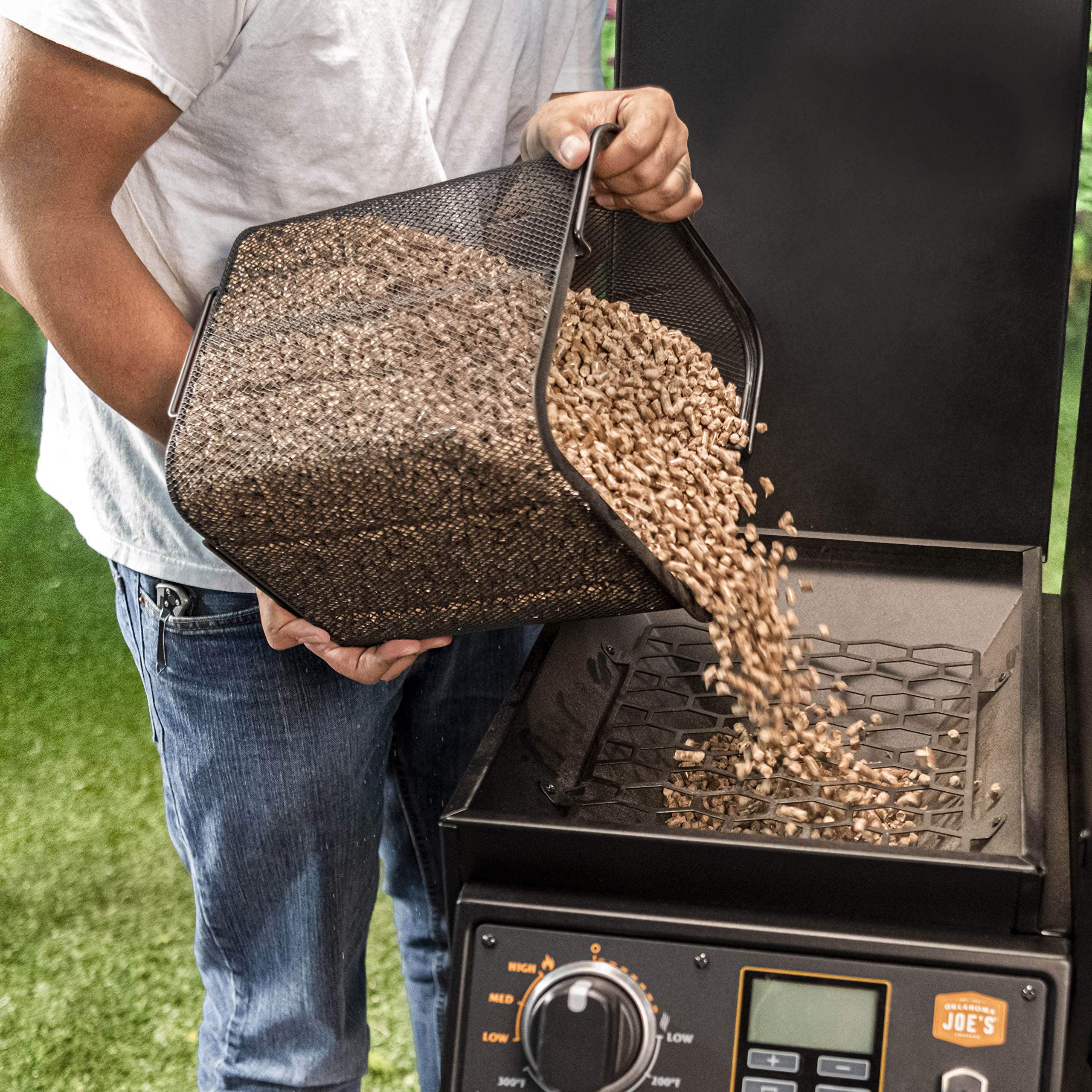Oklahoma Joe's pellet bucket wire-mesh filter closeup removing wood dust
