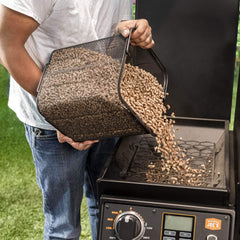 Oklahoma Joe's pellet bucket wire-mesh filter closeup removing wood dust
