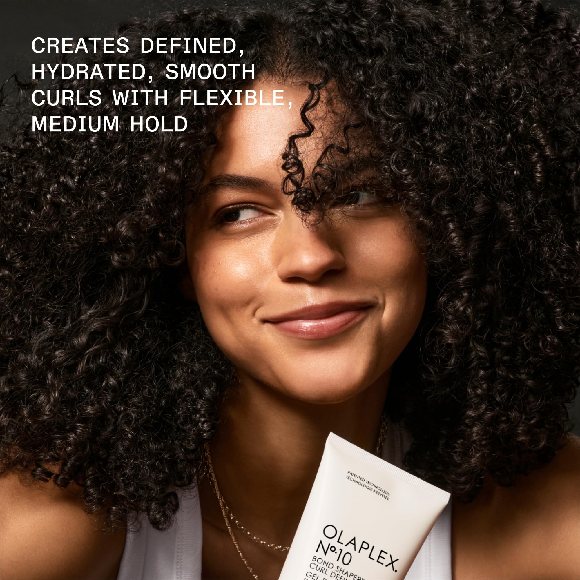 Olaplex N°.10 in hand for size comparison showing travel friendly benefit