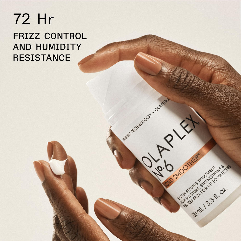Applying No.7 oil to dry hair ends showing added shine and softness benefit