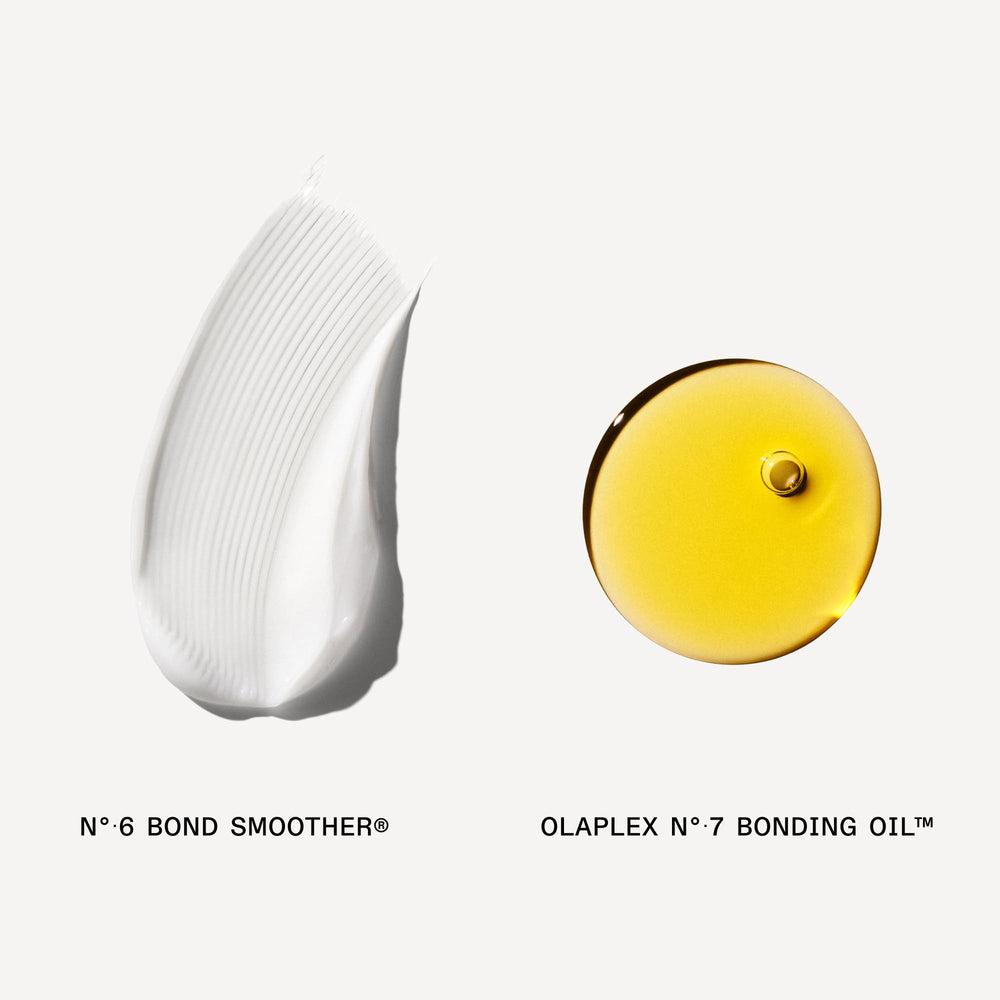 Hand holding both Olaplex bottles showing real scale and travel-friendly benefit
