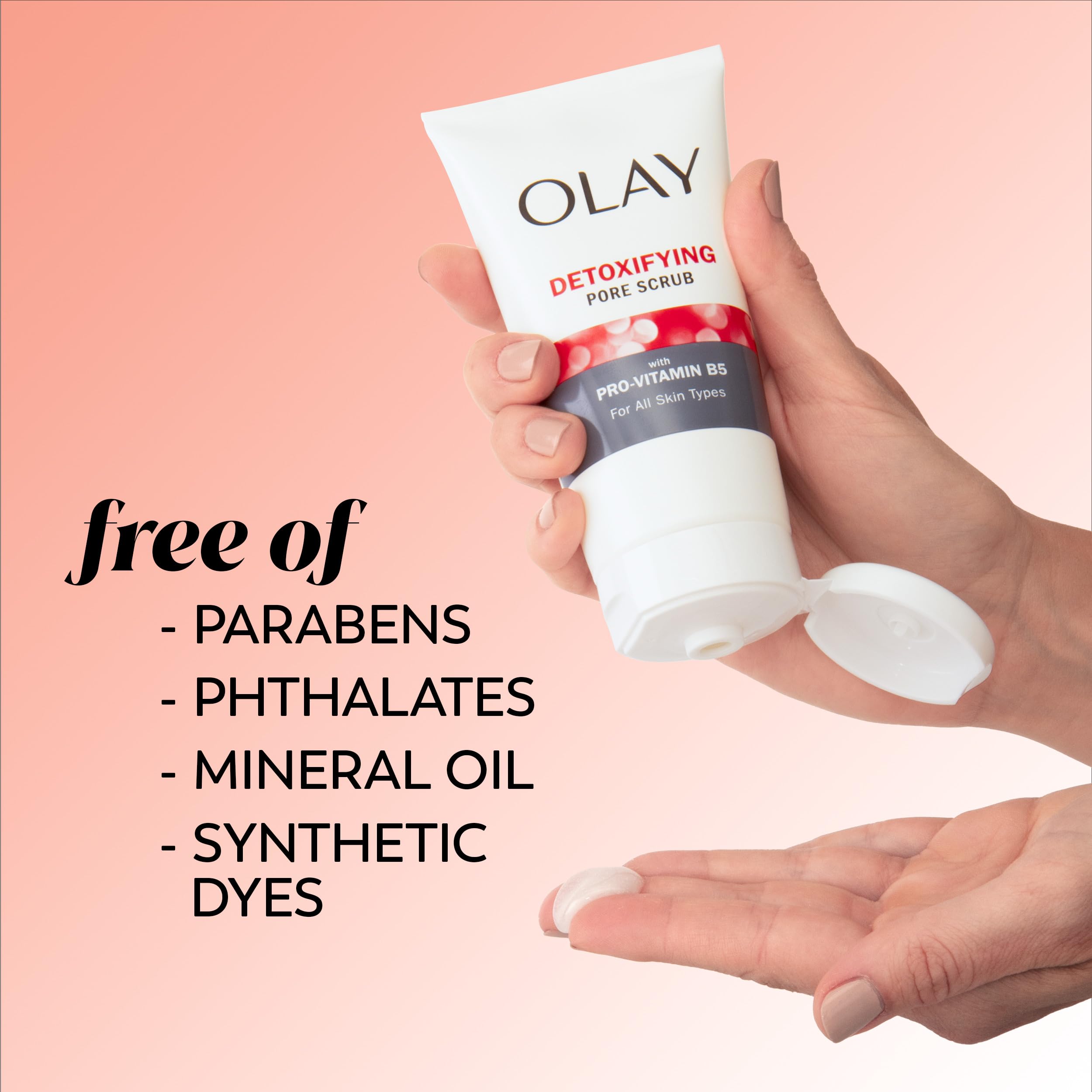 Olay scrub held in hand illustrating 5 oz size and travel-ready convenience