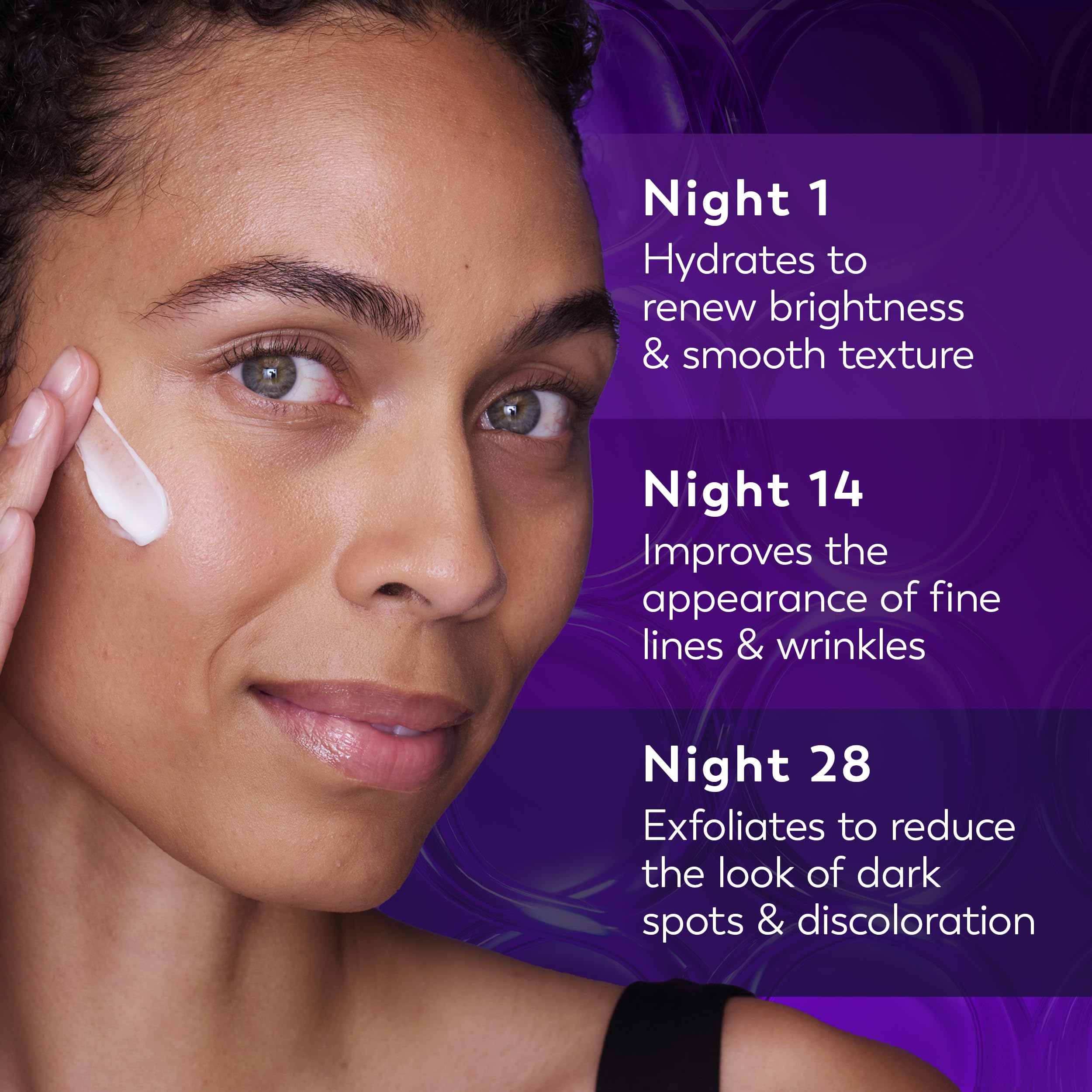 A fingertip spreading Olay retinol night cream on skin, shows moisturizing and smoothing effect