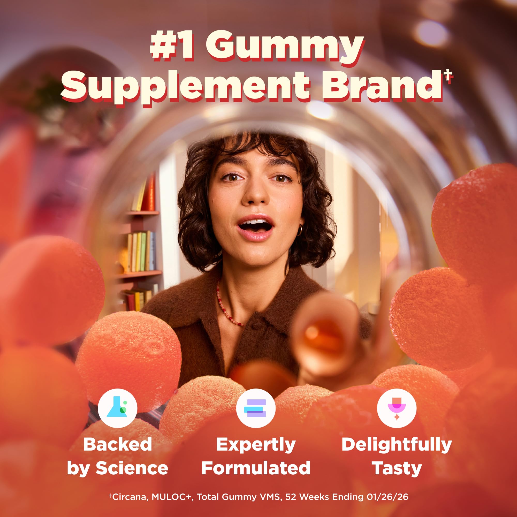 OLLY gummy in adult hand demonstrating chewable form and convenience