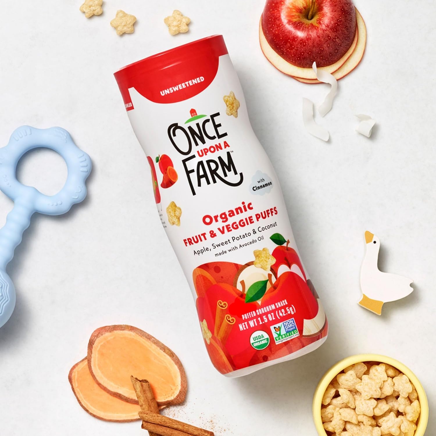 Once Upon a Farm avocado oil bottle next to puffs illustrating healthy fat choice