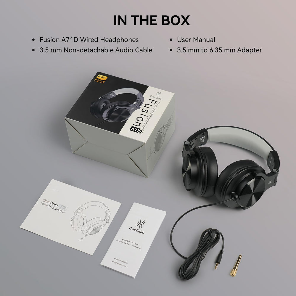 OneOdio A71D on headphones stand beside laptop and mixer for reliable studio monitoring