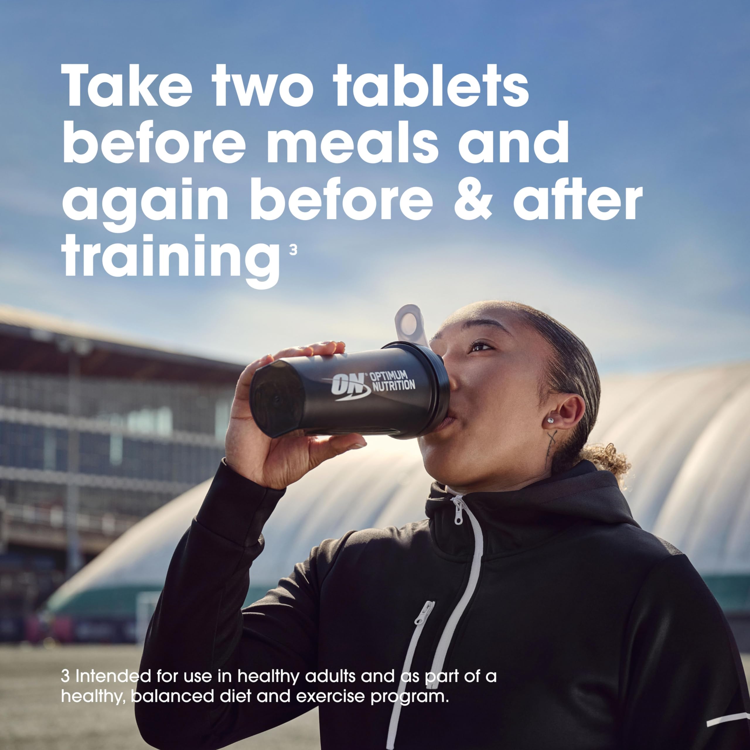 Capsules poured near gym gear to show Optimum Nutrition convenience for workouts
