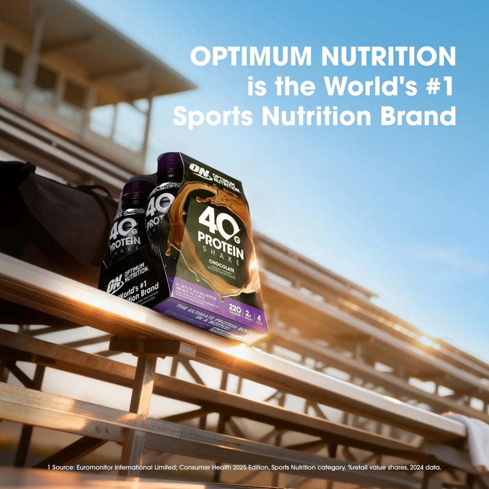 Optimum Nutrition bottle in hand for size and 14 fl oz scale comparison