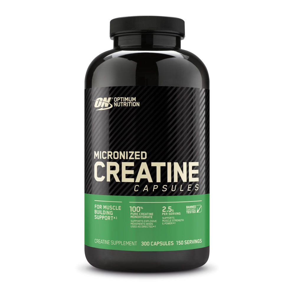 Two capsules beside a glass of water showing Optimum Nutrition ease of use