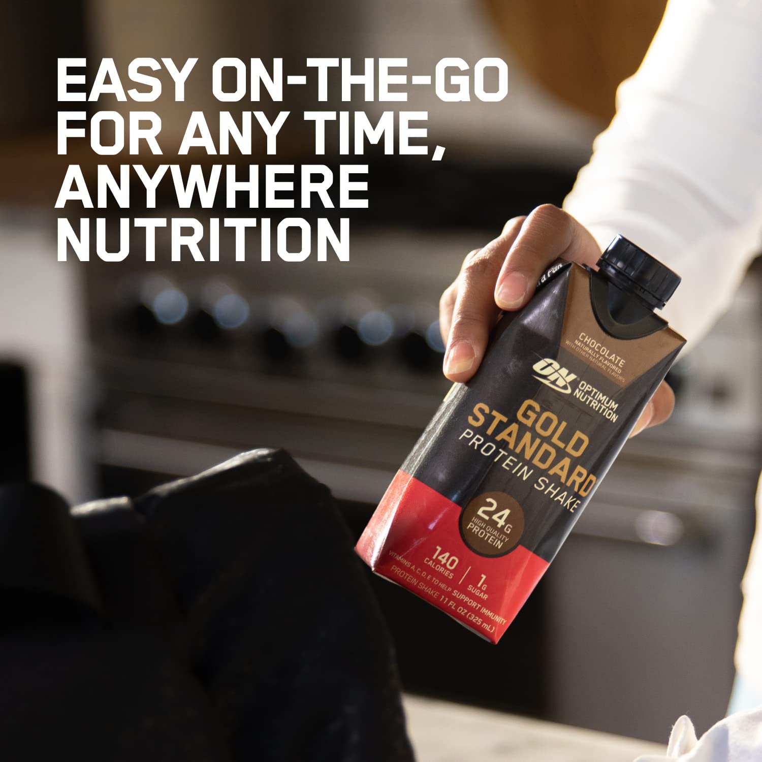Optimum Nutrition bottle tucked in gym bag showing portable post-workout convenience