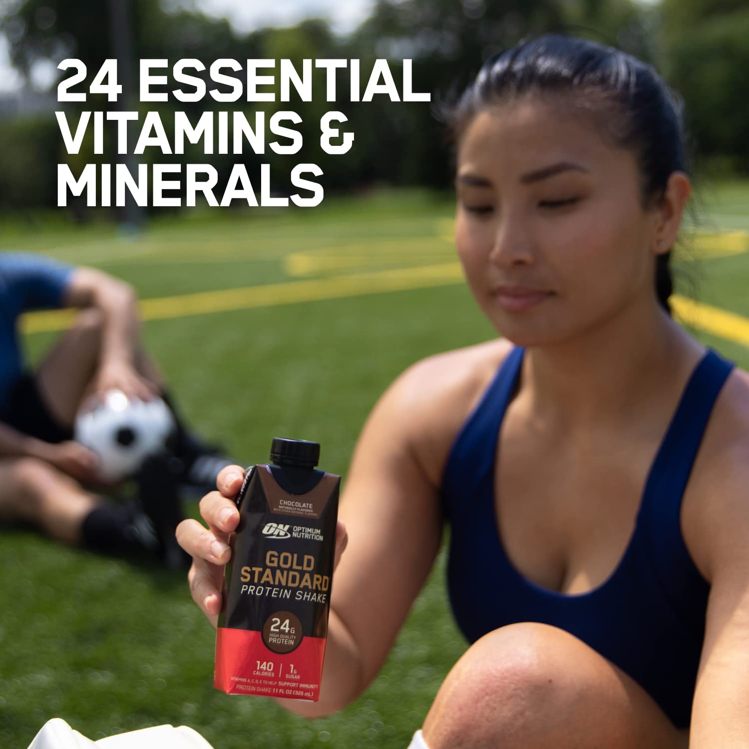 Optimum Nutrition held in hand for scale showing single-serve sizing and portability