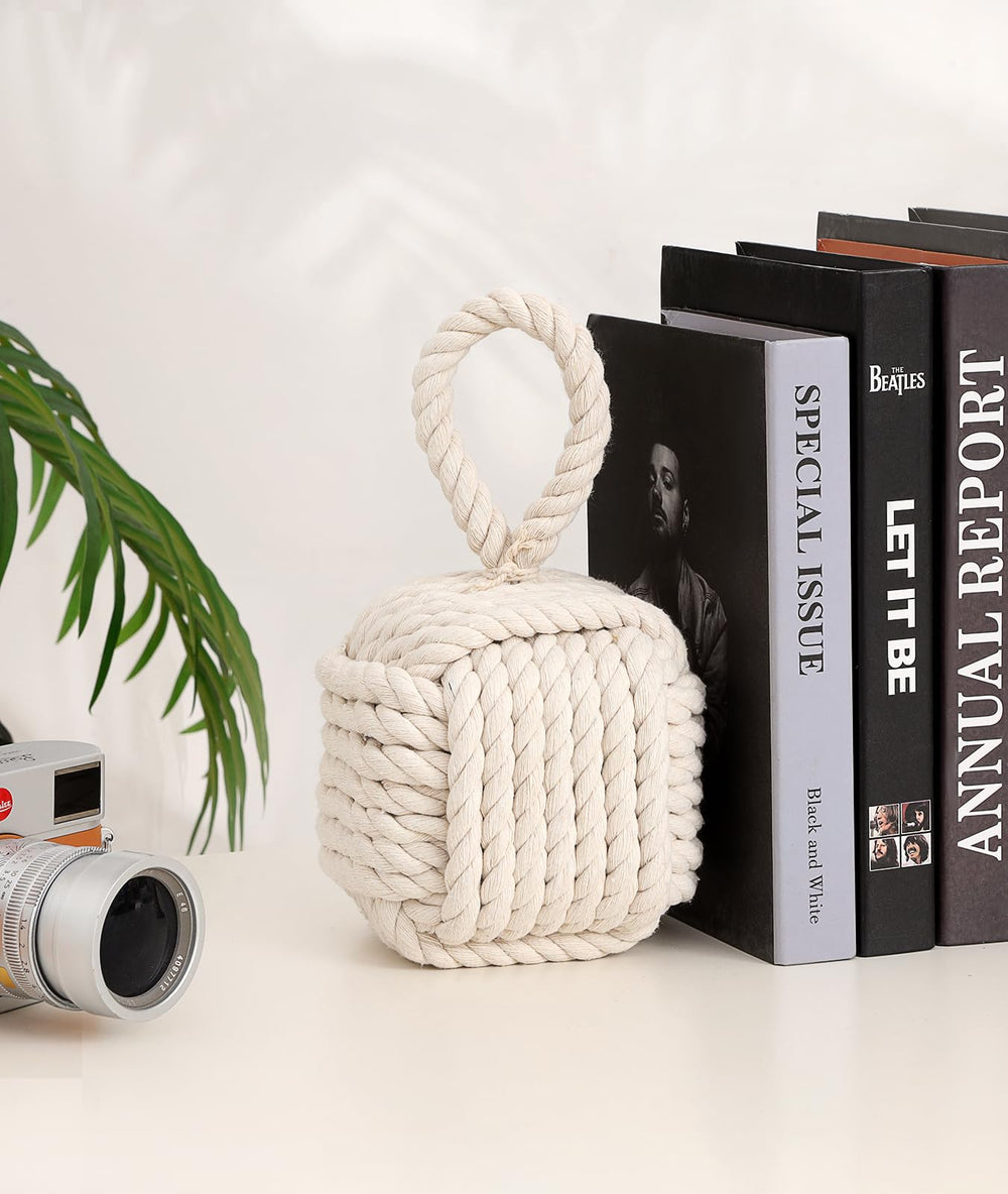 Optish beige rope knot doorstop in bedroom scene adding cozy decor and preventing door slams