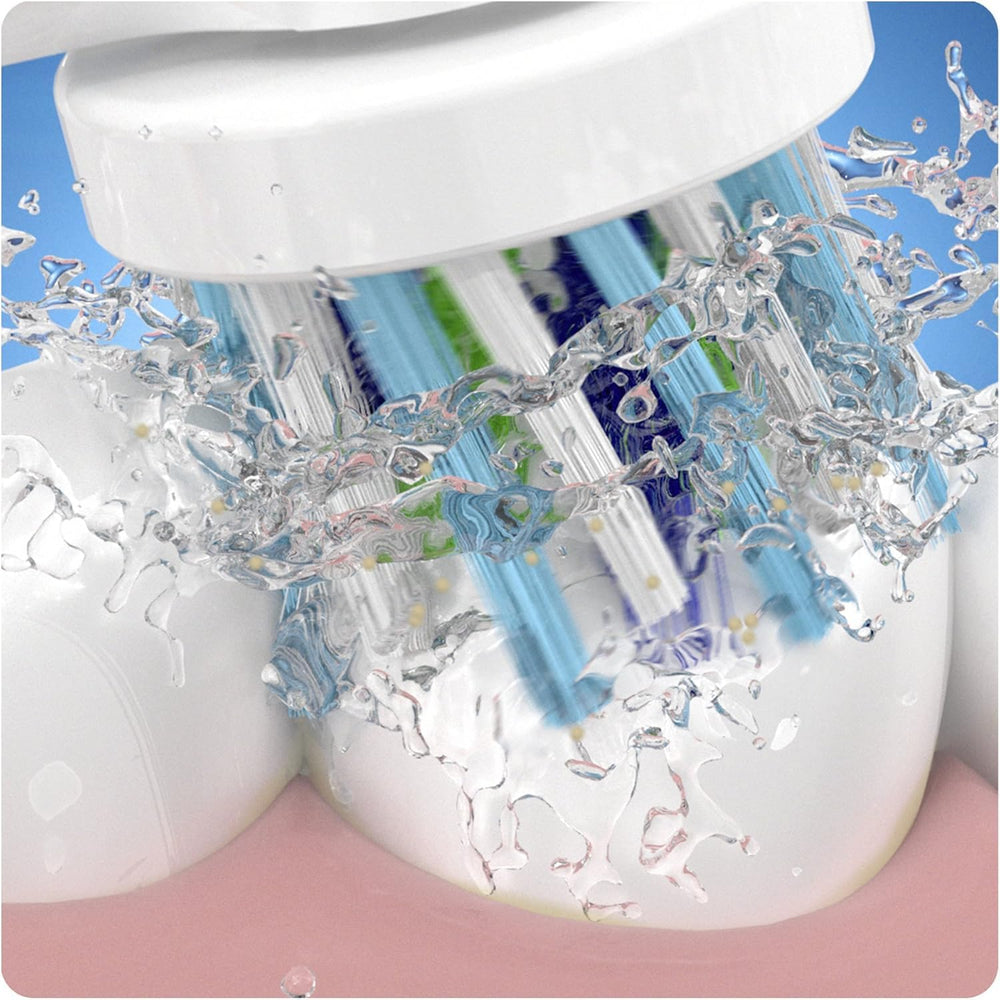 Oral-B CrossAction mounted on an electric handle in use for thorough tooth coverage