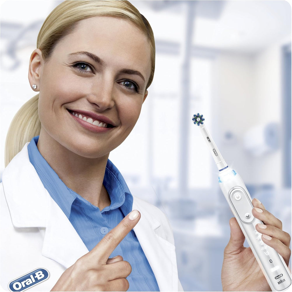 Oral-B CrossAction next to handle for size comparison and fast head swaps