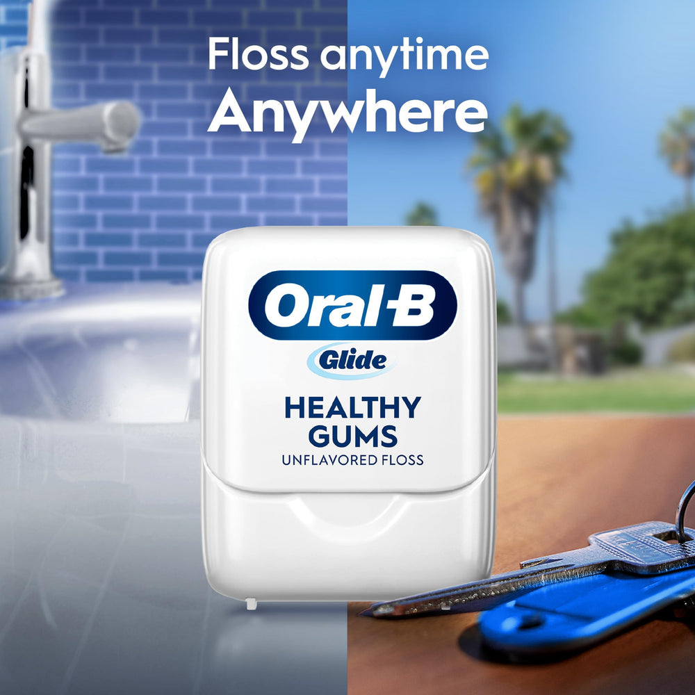 Oral-B spool next to a ruler to show 50-meter size and value