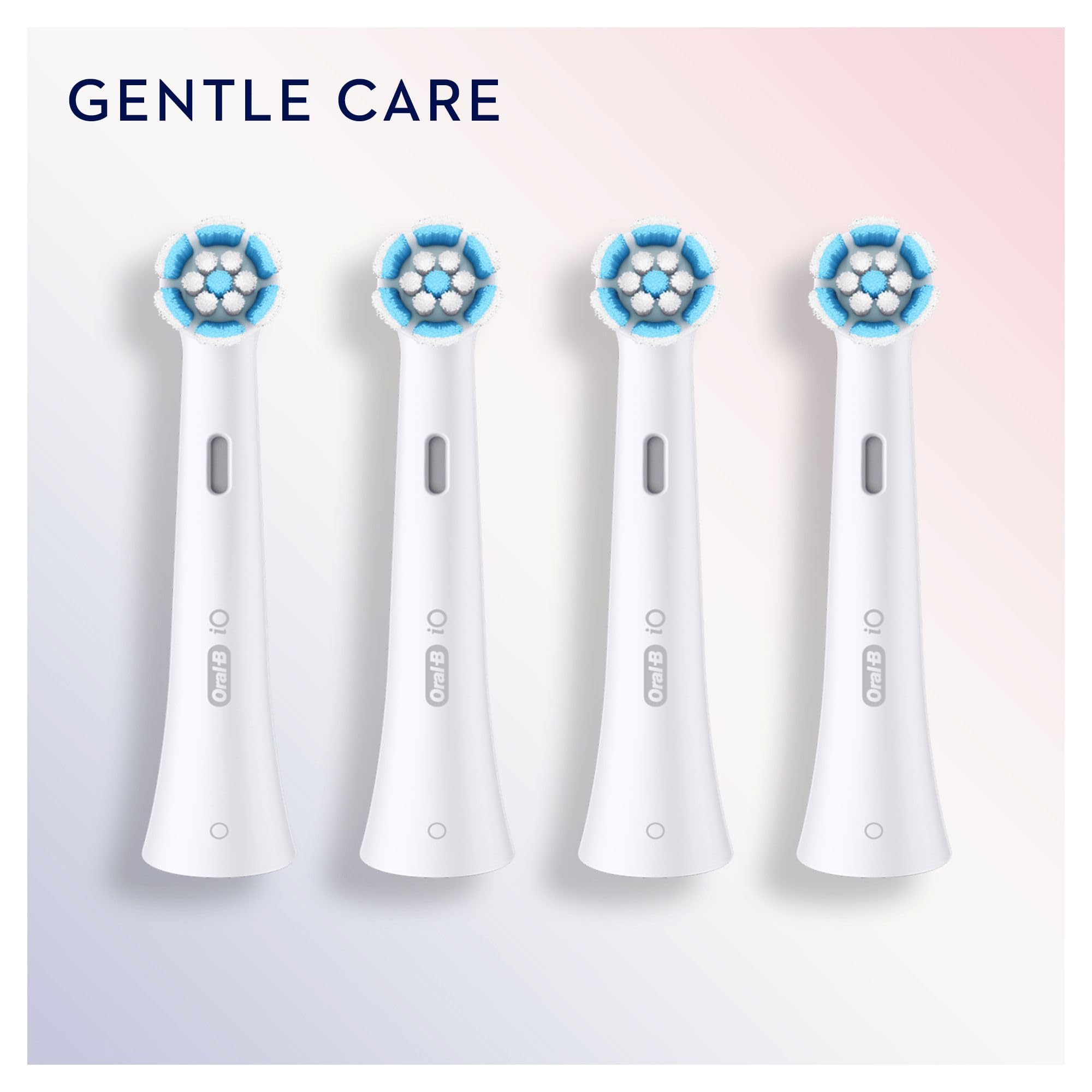 Oral-B brush head next to coin for size scale demonstrating compact round head
