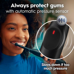 Oral-B handle pressure sensor glowing red to indicate too much force and protect gums